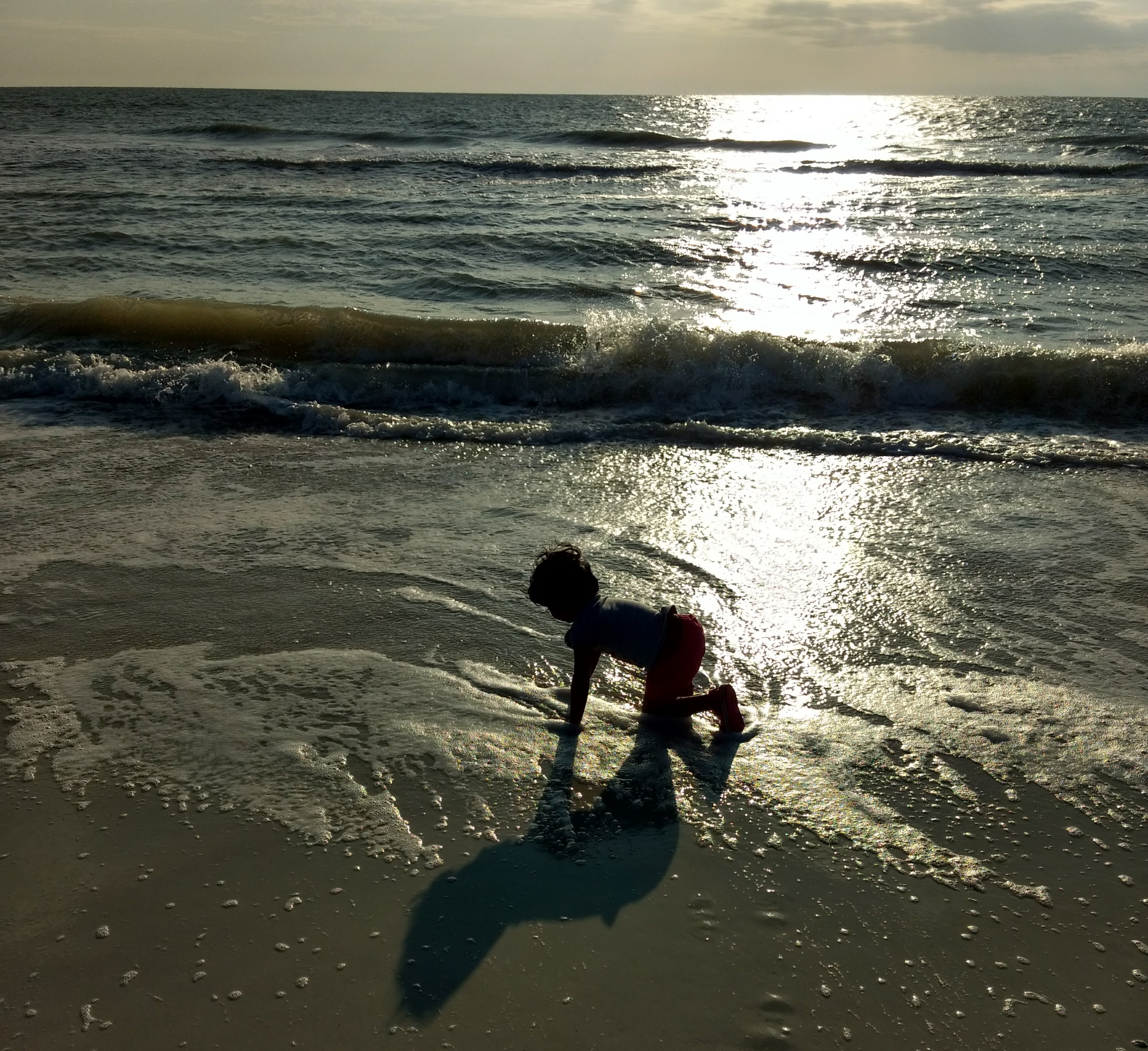 Child playing freely in beach